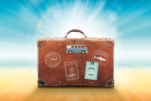 A vintage suitcase with travel stickers.