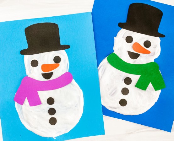Two examples of a snowman craft picture made with puffy paint and colored cardstock.