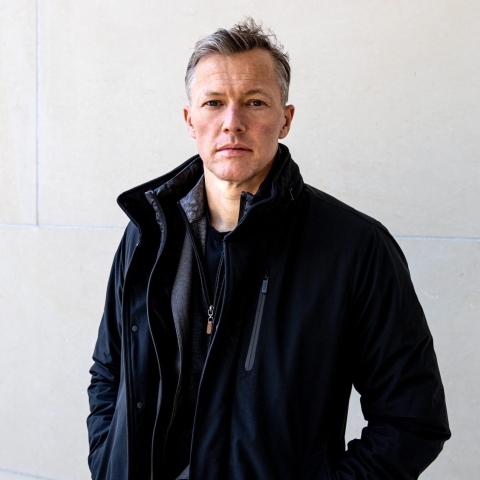A person in a black jacket.