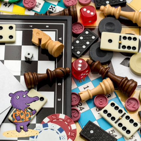 An assortment of board game pieces poured on a table.