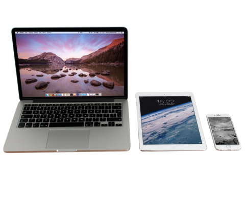 An open laptop, a tablet, and a smartphone.