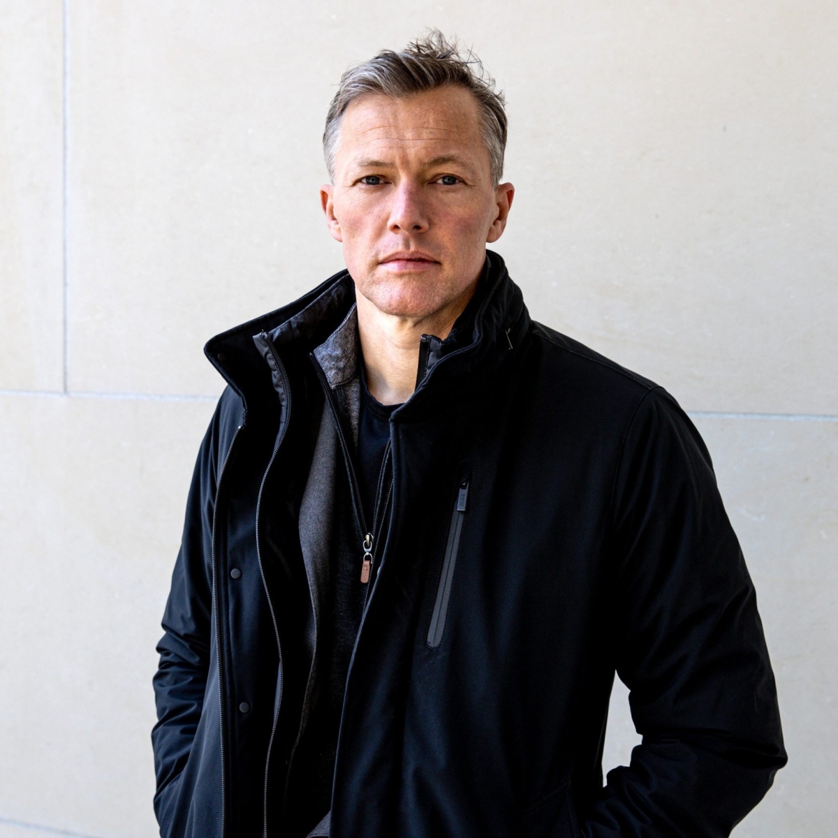 A person in a black jacket.